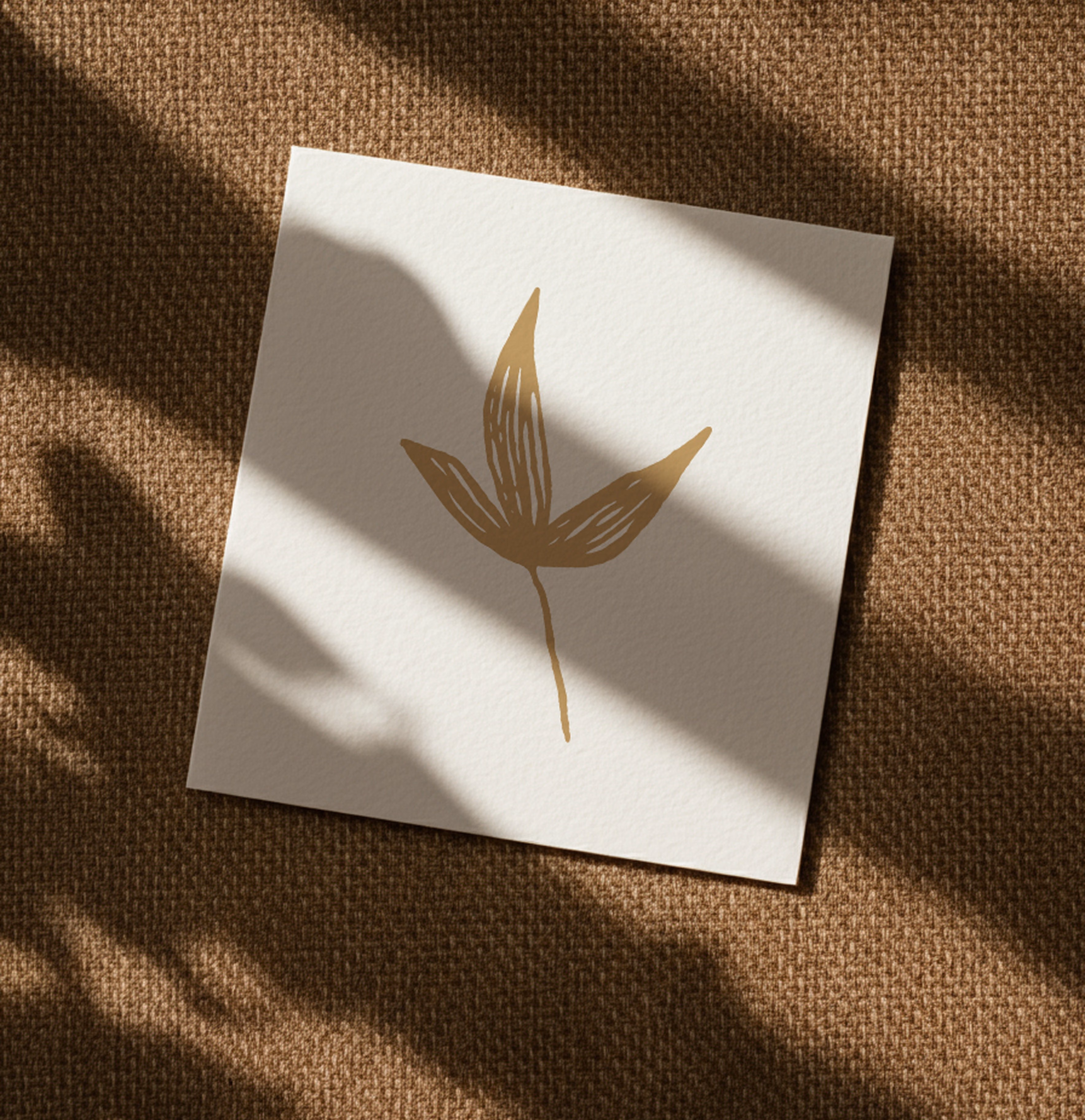 Golden Luxe gold leaf logo mark foiled on a cream card